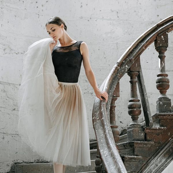 Person gracefully stretching, demonstrating improved body flexibility.