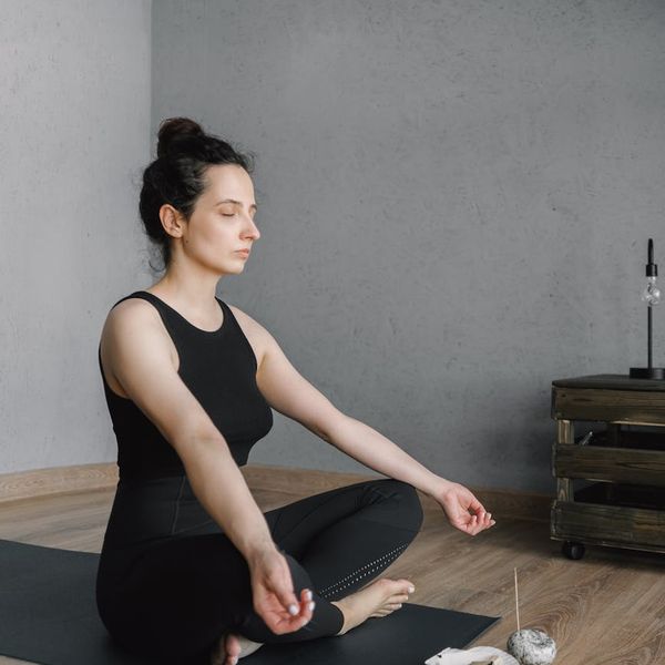 Smiling person feeling energetic after a yoga session.